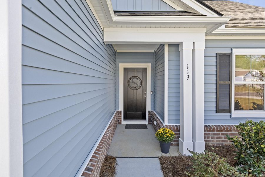 Exterior details and patio area of a home in Cedar Glen Preserve, Huger (Image 28).