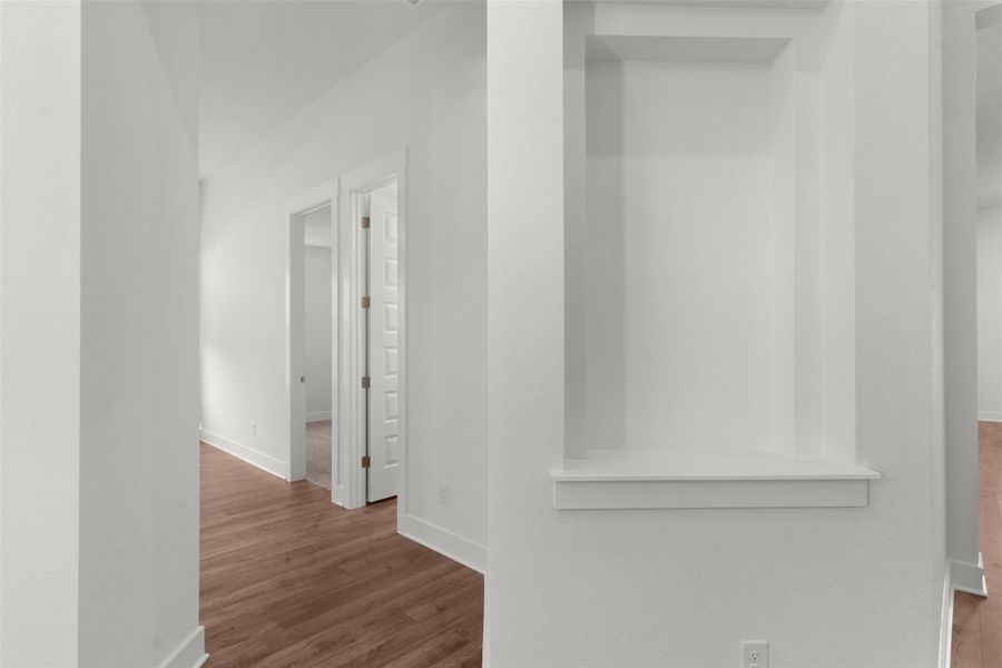 Corridor with wood finished floors