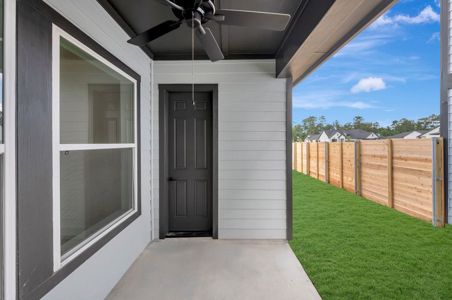 Exterior details and patio area of a home in Two Step Farm - Cottages Row Collection, Montgomery (Image 3).