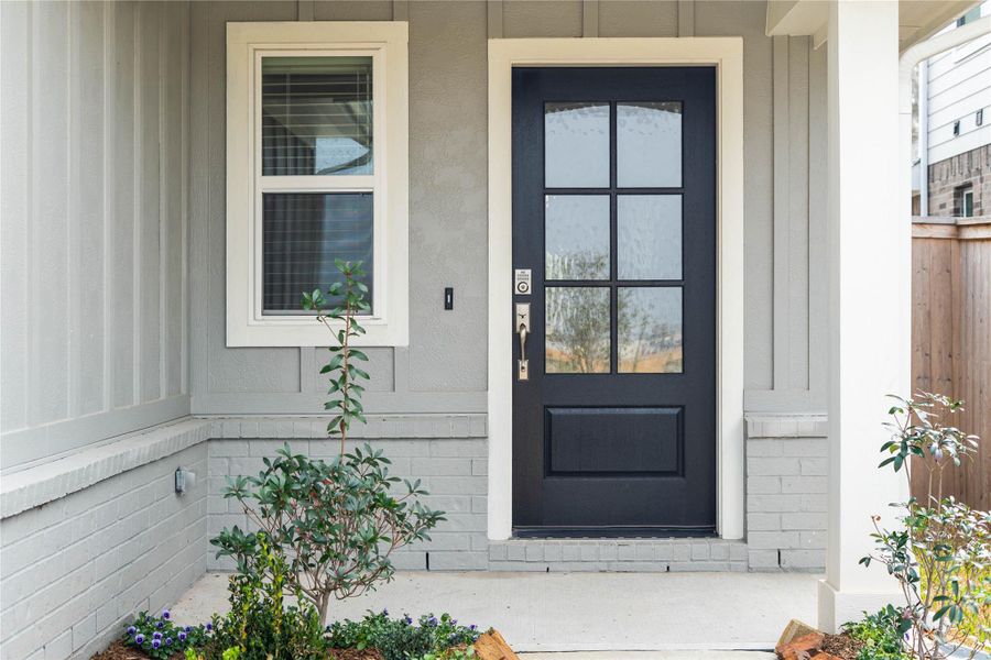 This home is modern elegance with a timeless brick exterior and high quality entry door.