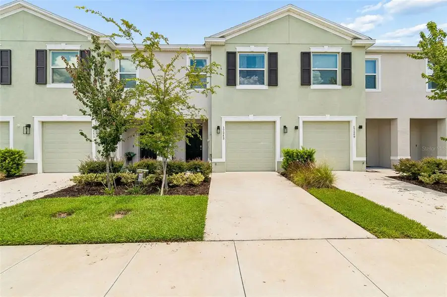 Front exterior of a new home in , Land O' Lakes, FL, highlighting curb appeal (Image 30).