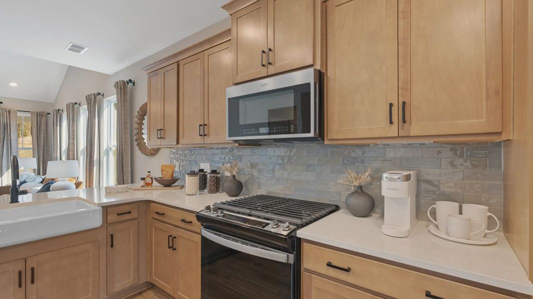 Designer kitchen showcasing quartz countertops and sleek cabinetry of the Finley Design