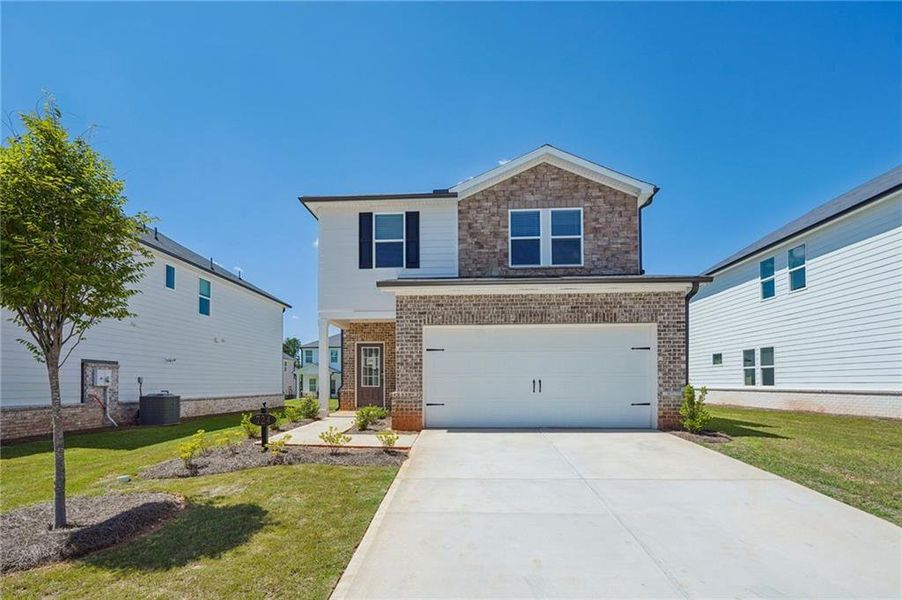 Front exterior of a new home in Martin Springs - Reserve Series, Lawrenceville, GA, highlighting curb appeal (Image 19).