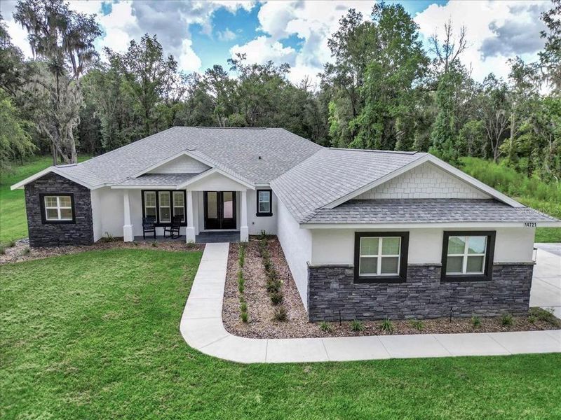 Front exterior of a new home in , Williston, FL, highlighting curb appeal (Image 23).