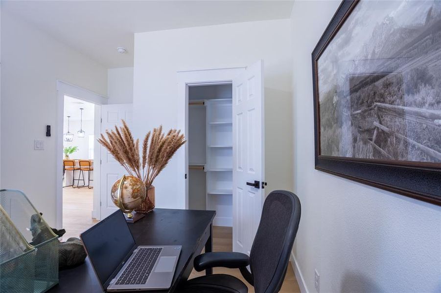 Bedroom with closet / Office featuring wood finished floors