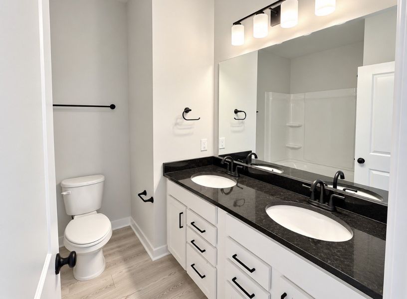 Furnished interior view inside a new home in Hickory Cove, Burns (Image 12).