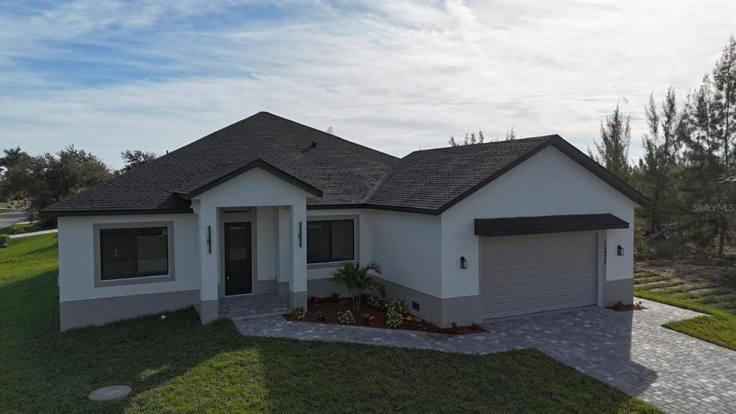 Front exterior of a new home in , Port Charlotte, FL, highlighting curb appeal (Image 36). Front exterior of a new home in , Port Charlotte, FL, highlighting curb appeal (Image 36).