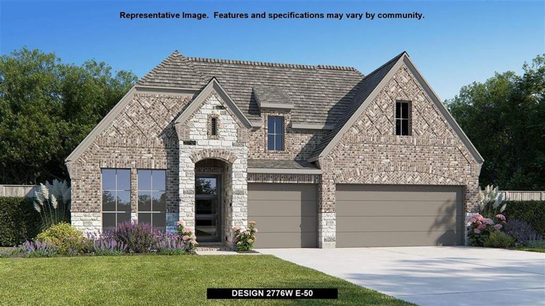 View of front of house with a front lawn and a garage