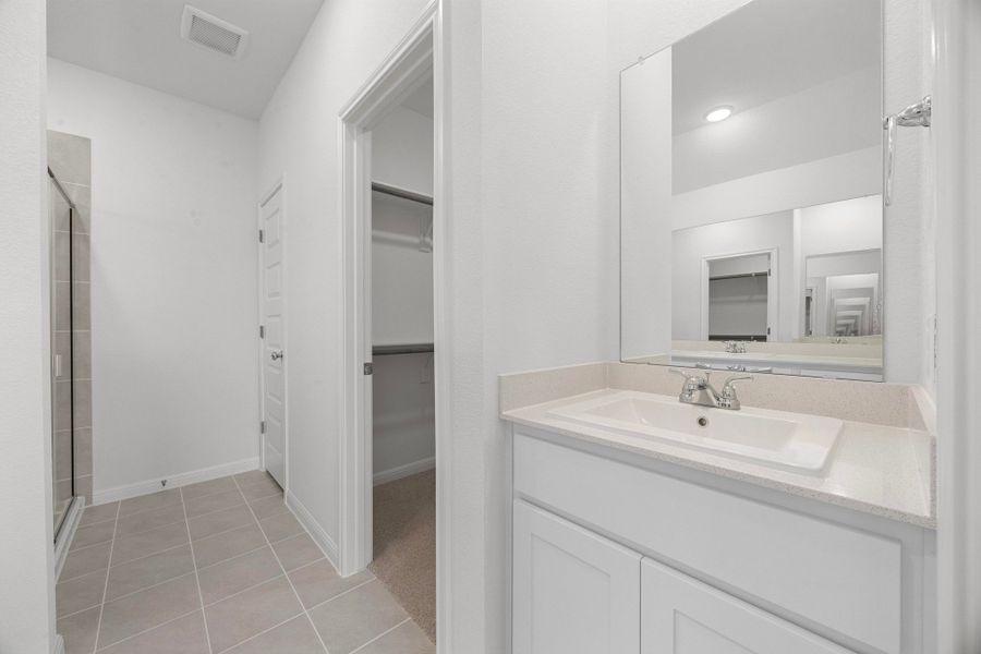 Primary Bath in the Cypress home plan by Trophy Signature Homes - REPRESENTATIVE PHOTO