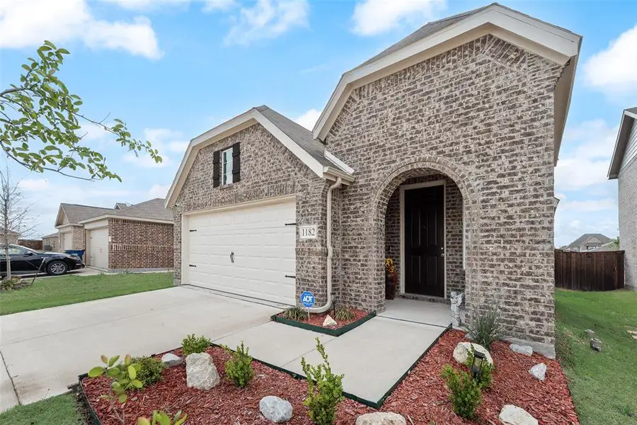 Exterior details and patio area of a home in Walden Pond, Forney (Image 24).