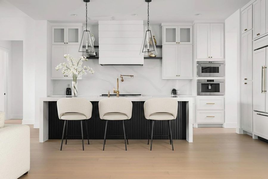 Contemporary kitchen featuring a large island with fluted paneling and pendant lighting