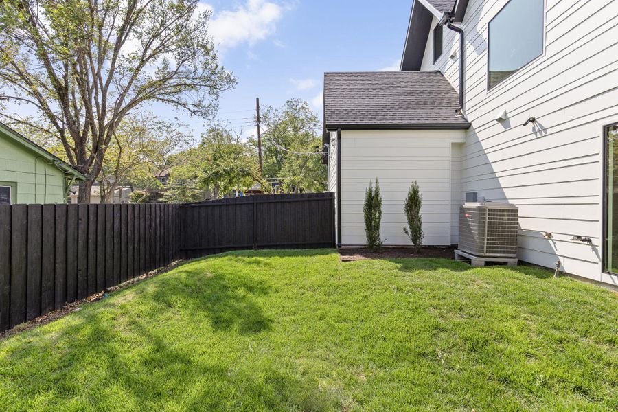 View of fenced backyard