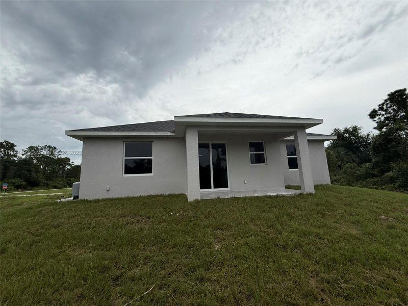 Exterior details and patio area of a home in , Lehigh Acres (Image 3). Exterior details and patio area of a home in , Lehigh Acres (Image 3).