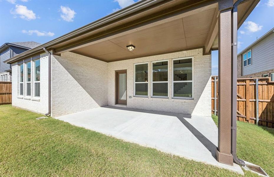 Large covered patio offers ample space for entertaining or relaxing Large covered patio offers ample space for entertaining or relaxing