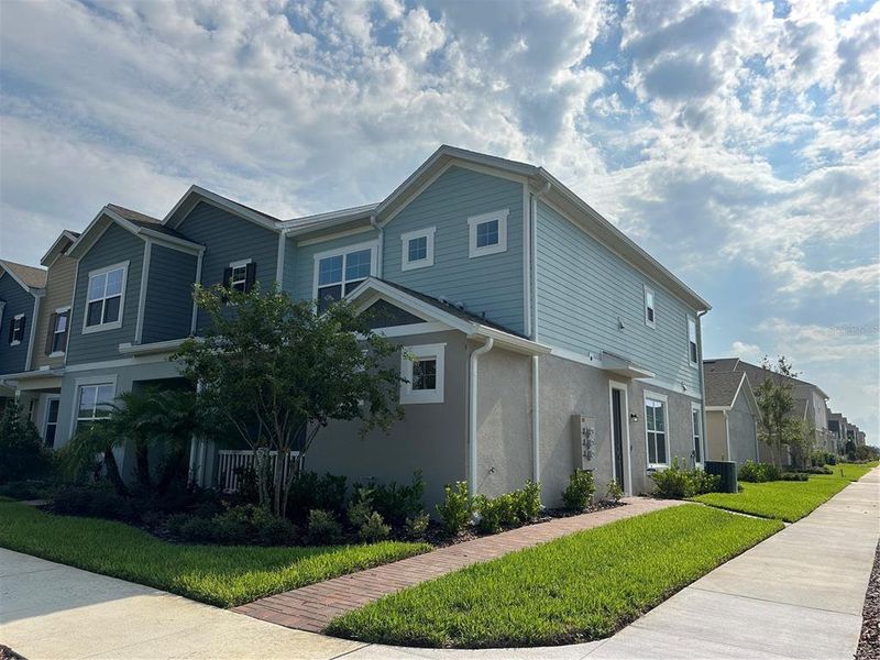 Front exterior of a new home in , Winter Garden, FL, highlighting curb appeal (Image 1). Front exterior of a new home in , Winter Garden, FL, highlighting curb appeal (Image 1).