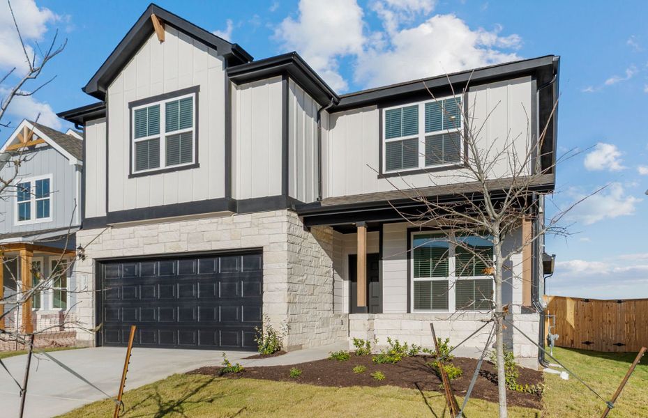 Front exterior of a new home in Patterson Ranch, Georgetown, TX, highlighting curb appeal (Image 20).