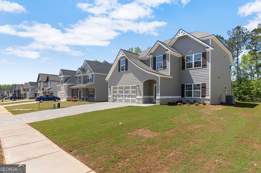 Front exterior of a new home in Juliette Crossing, Forsyth, GA, highlighting curb appeal (Image 28).