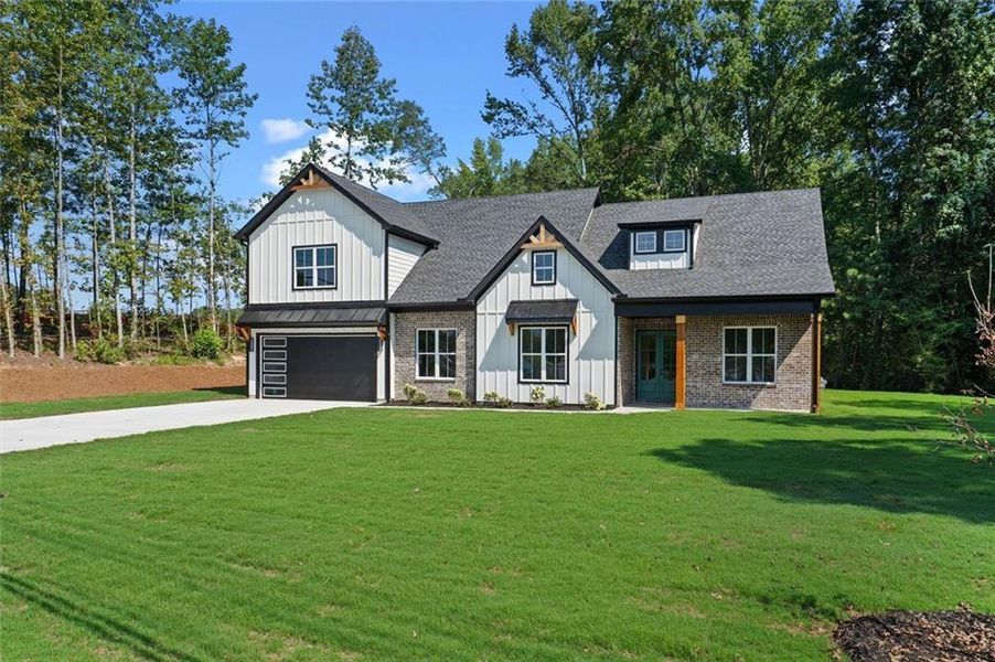 Front exterior of a new home in , Powder Springs, GA, highlighting curb appeal (Image 18).