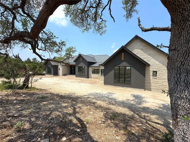 Front exterior of a new home in , Canyon Lake, TX, highlighting curb appeal (Image 10). Front exterior of a new home in , Canyon Lake, TX, highlighting curb appeal (Image 10).