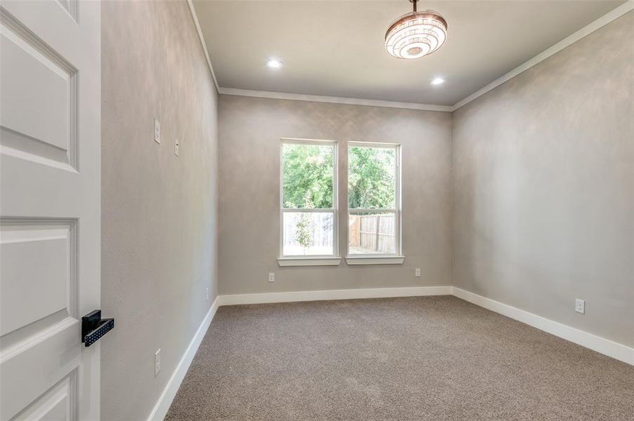Unfurnished room featuring crown molding, carpet, and recessed lighting