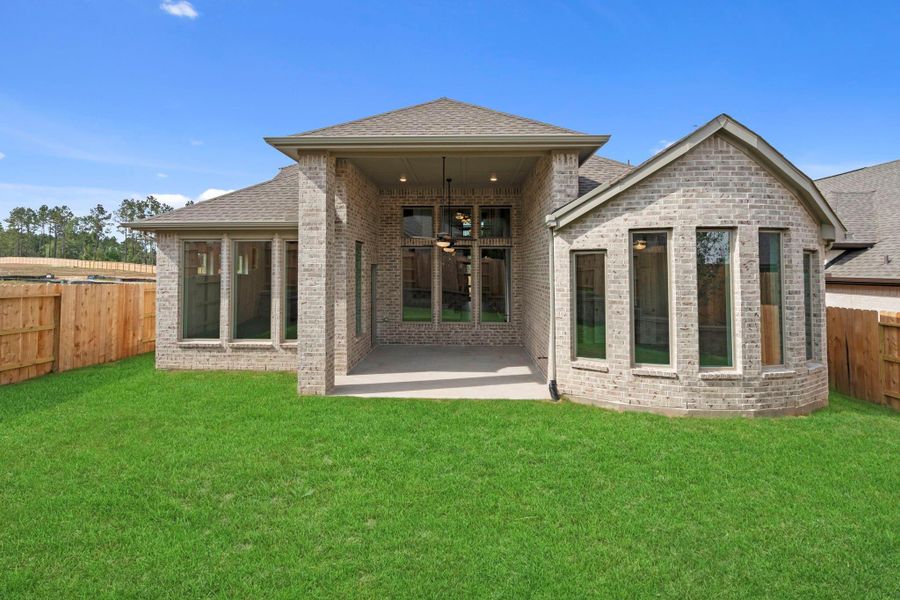 Exterior details and patio area of a home in Wildtree, Magnolia (Image 4).