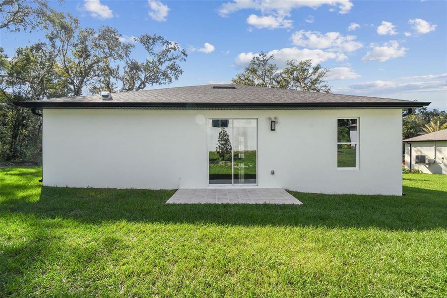 Exterior details and patio area of a home in , Brooksville (Image 3).