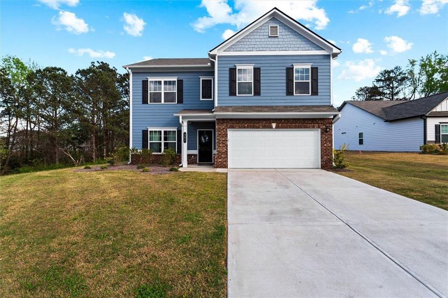 Front exterior of a new home in Garrett Preserve, Hiram, GA, highlighting curb appeal (Image 34).