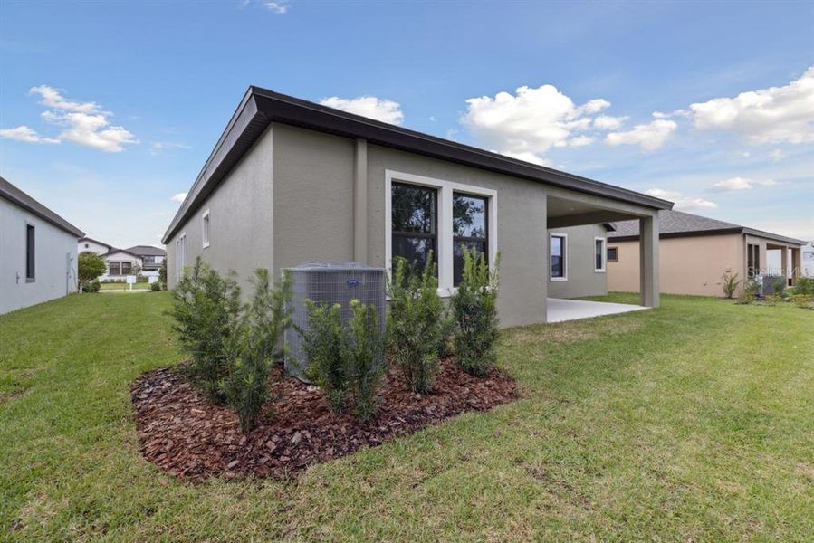 Exterior details and patio area of a home in Caldera, Spring Hill (Image 19).