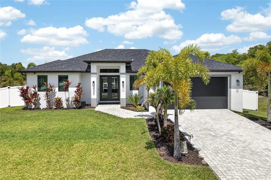 Front exterior of a new home in , Cape Coral, FL, highlighting curb appeal (Image 22).