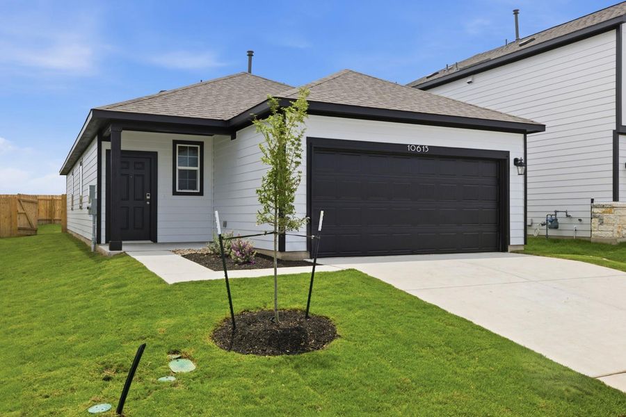 Front exterior of a new home in Stallion Run, Buda, TX, highlighting curb appeal (Image 22).