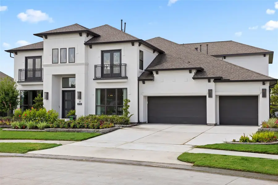 Front exterior of a new home in Bridgeland, Cypress, TX, highlighting curb appeal (Image 20).