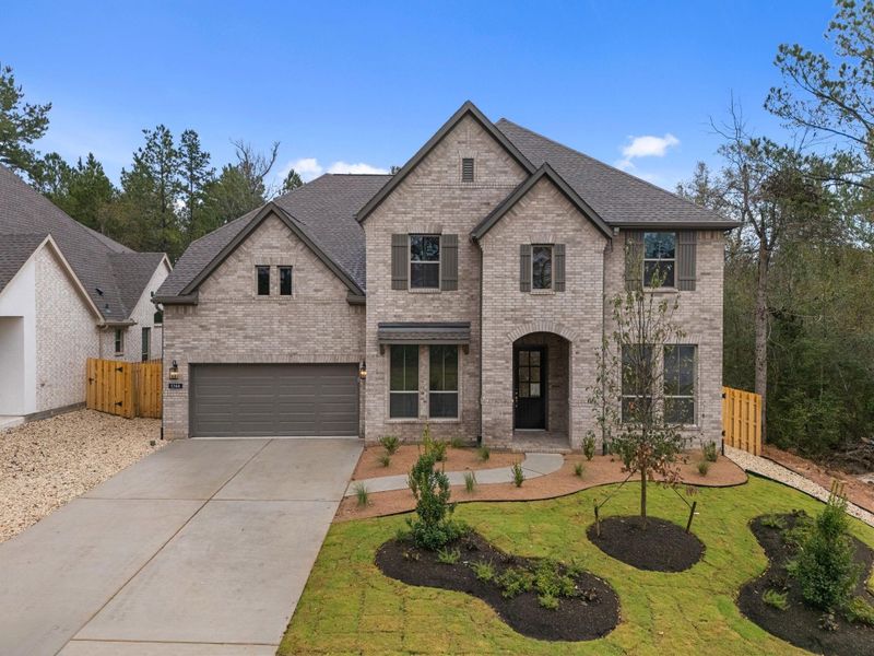 Front exterior of a new home in COLTON, Montgomery, TX, highlighting curb appeal (Image 2). Front exterior of a new home in COLTON, Montgomery, TX, highlighting curb appeal (Image 2).