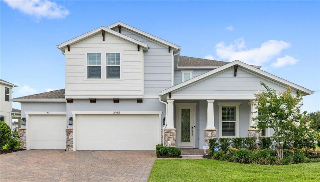 Front exterior of a new home in Acuera Estates, Apopka, FL, highlighting curb appeal (Image 32). Front exterior of a new home in Acuera Estates, Apopka, FL, highlighting curb appeal (Image 32).