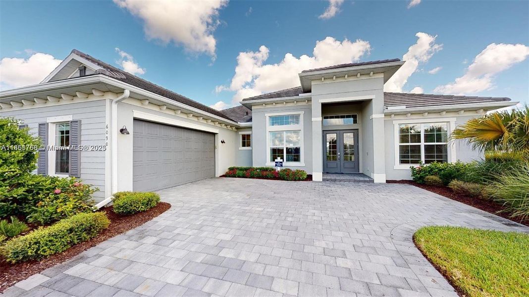 Front exterior of a new home in , Immokalee, FL, highlighting curb appeal (Image 27).