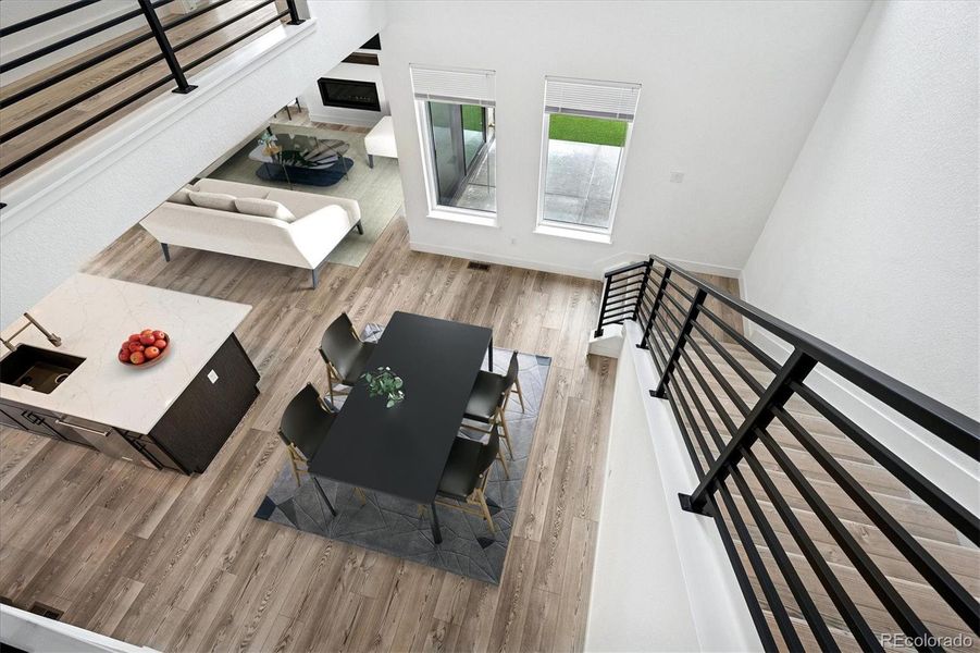 Virtually staged overview of dining; kitchen island and living room Virtually staged overview of dining; kitchen island and living room