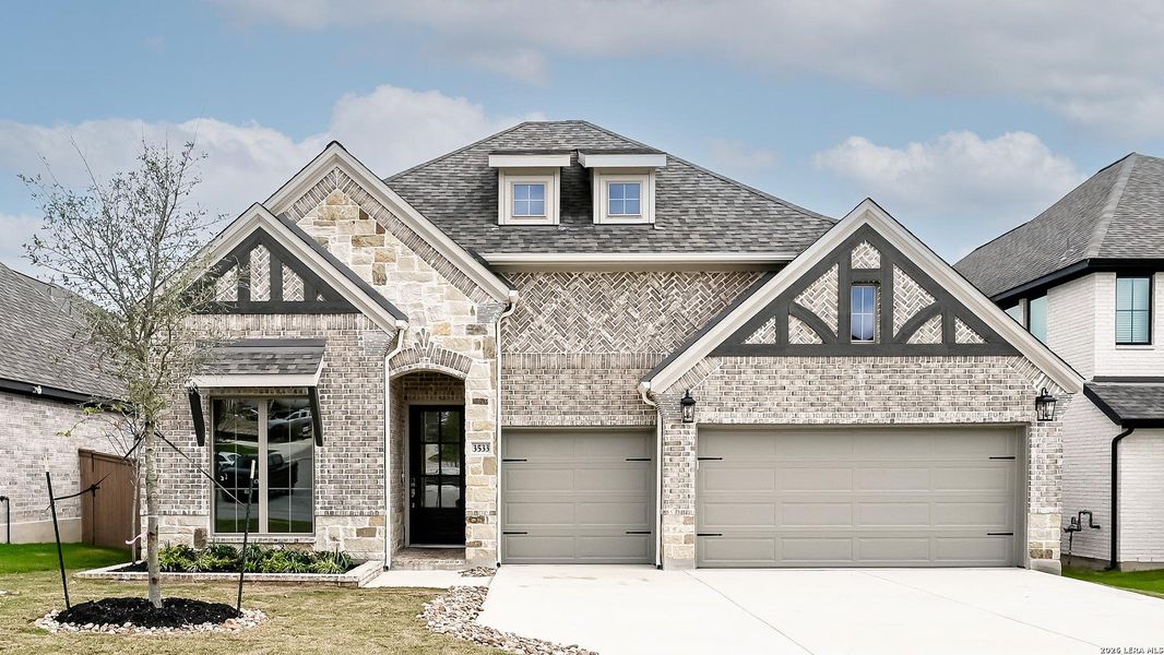 Front exterior of a new home in Johnson Ranch, Bulverde, TX, highlighting curb appeal (Image 2).