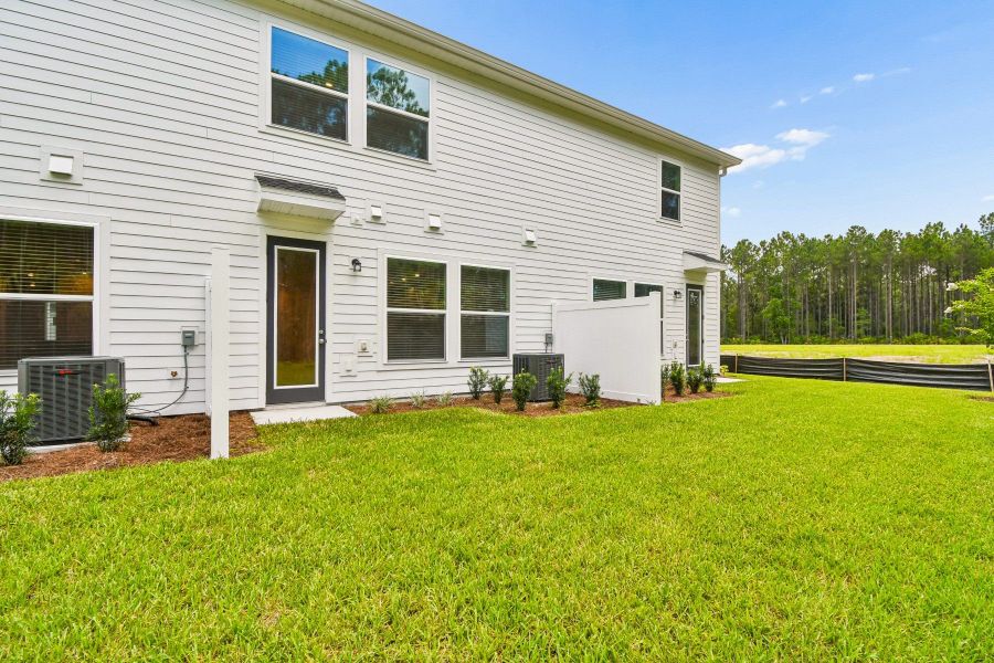 Exterior details and patio area of a home in Preserve at The Cays – The Harbor Series, Daytona Beach (Image 22).