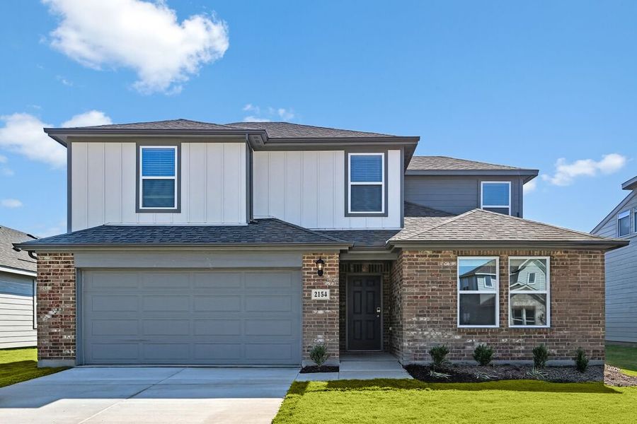 Front exterior of a new home in River Ridge, Crandall, TX, highlighting curb appeal (Image 1). Front exterior of a new home in River Ridge, Crandall, TX, highlighting curb appeal (Image 1).
