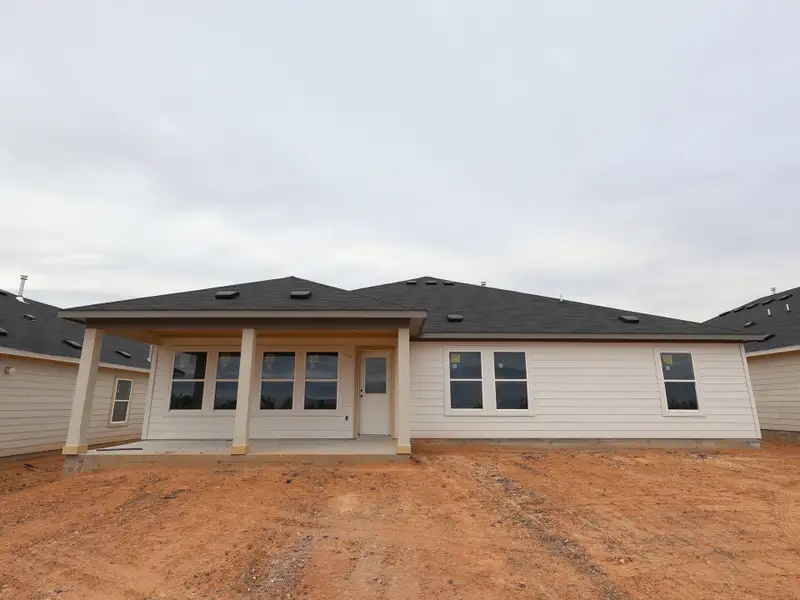 Exterior details and patio area of a home in Carillon, Manor (Image 3).