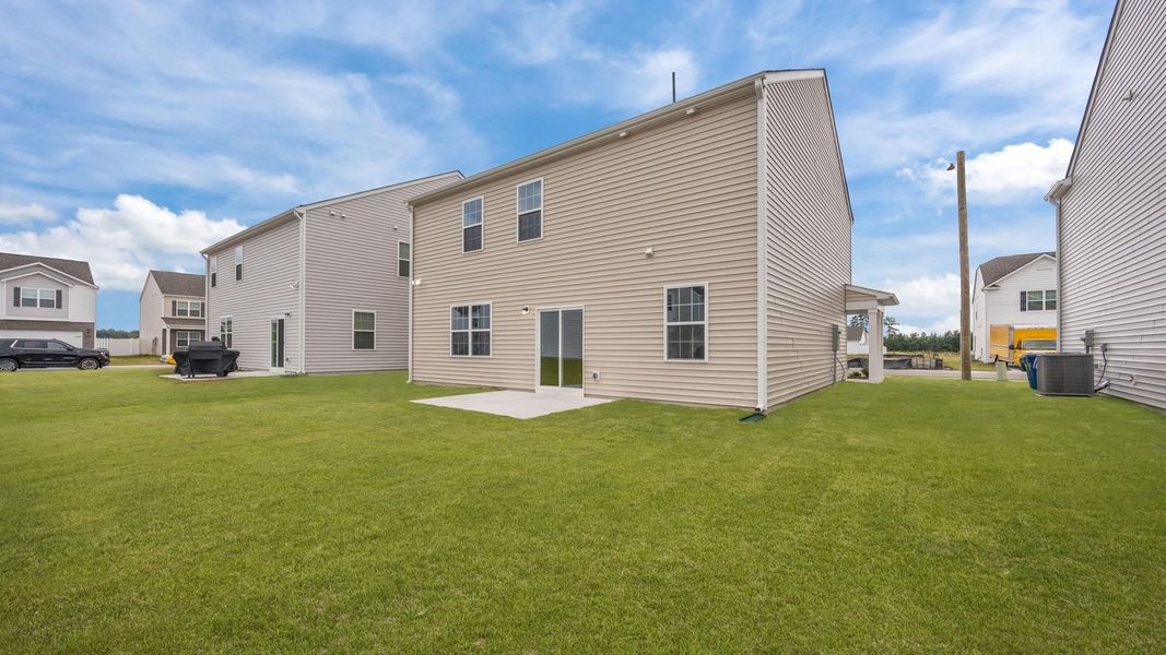 Exterior details and patio area of a home in Ridgewood Farms, Winterville (Image 20).