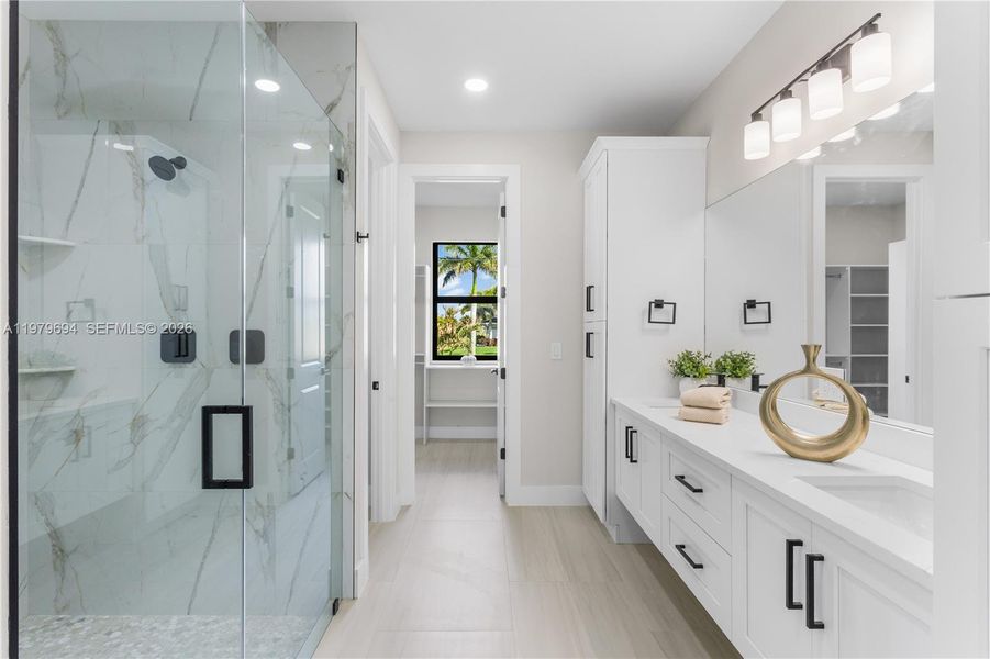 LUXURIOUS PRIMARY BATHROOM w/ spacious WALK-IN GLASS SHOWER w/ floor-to-ceiling designer tile, rainfall showerhead, built-in bench & modern matte-black fixtures. LUXURIOUS PRIMARY BATHROOM w/ spacious WALK-IN GLASS SHOWER w/ floor-to-ceiling designer tile, rainfall showerhead, built-in bench & modern matte-black fixtures.