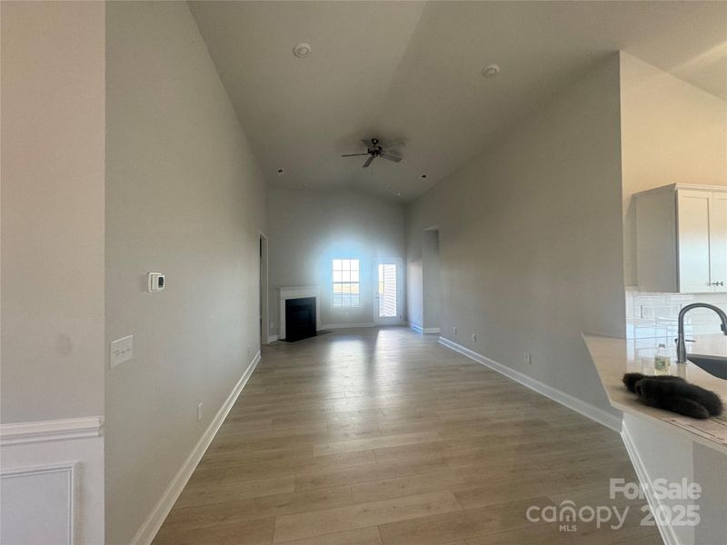Spacious family room with cathedral ceiling and fire place