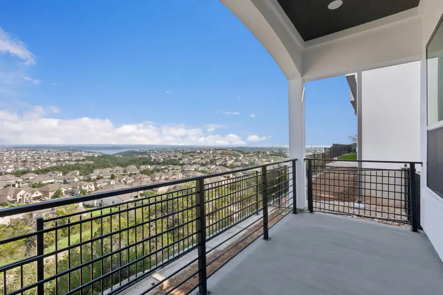 Exterior details and patio area of a home in The Point at Rough Hollow, Lakeway (Image 3).