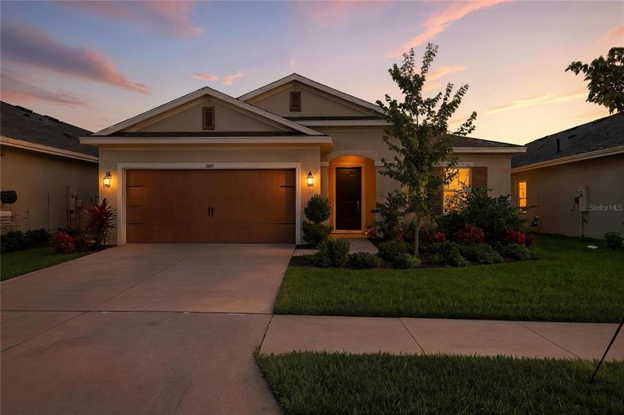Front exterior of a new home in Waterset, Apollo Beach, FL, highlighting curb appeal (Image 24).