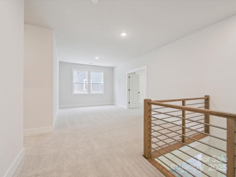 Spacious, unfurnished interior of a new home in North Creek Village, Huntersville (Image 29).