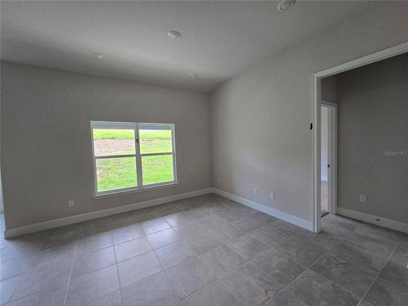 view of living room, entrance to main bedroom view of living room, entrance to main bedroom