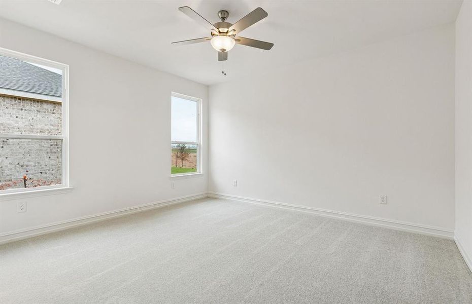 Owner's bedroom with ceiling fan