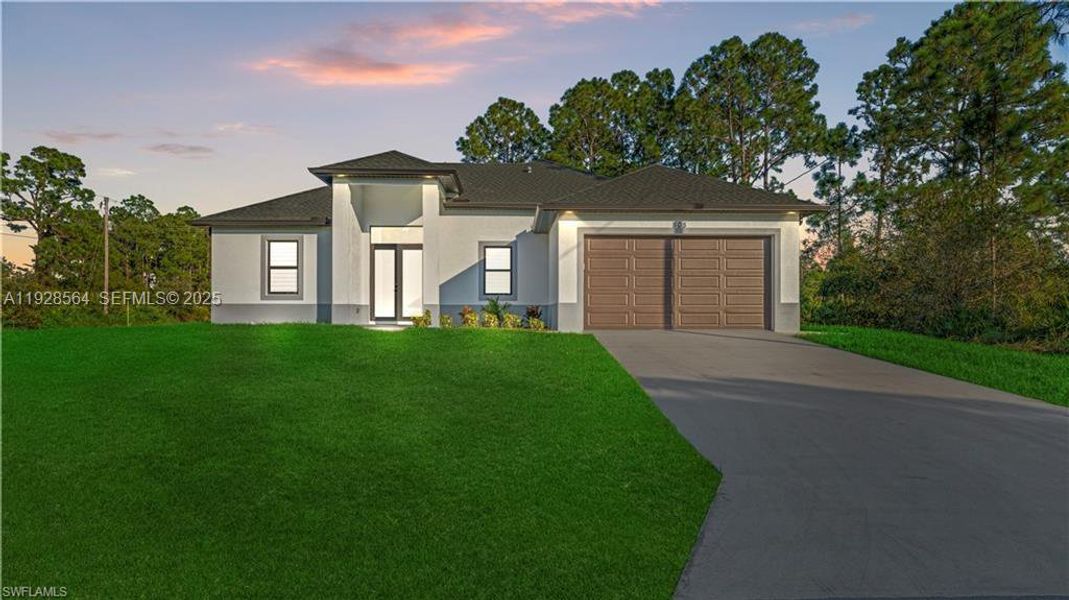 Front exterior of a new home in , Lehigh Acres, FL, highlighting curb appeal (Image 23).