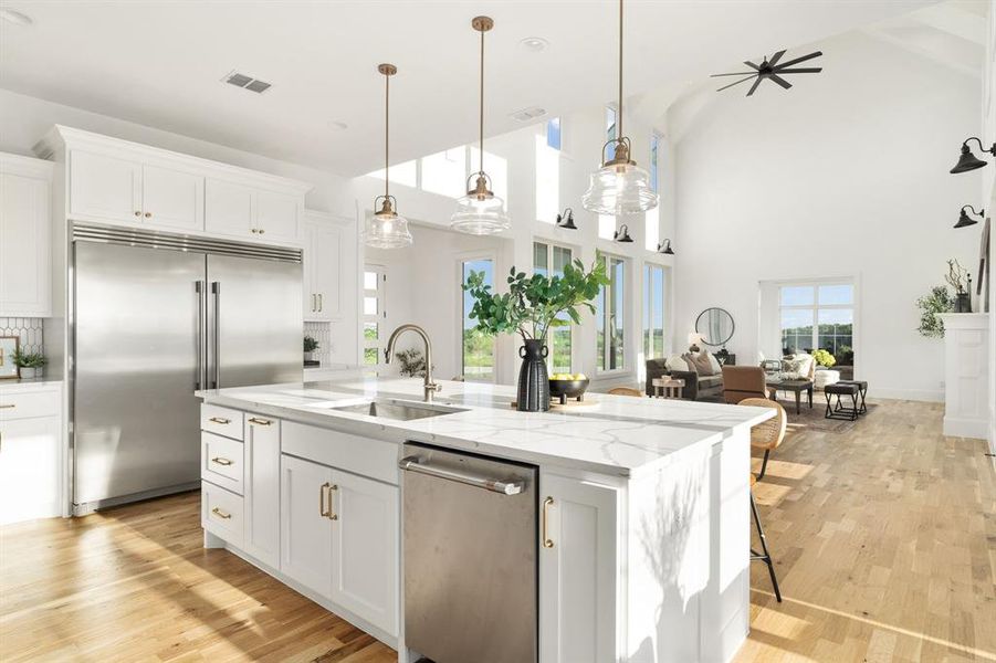 Another view that really showcases the ceilings in the living room. Oh, and the gorgeous hardware and lighting in the kitchen.