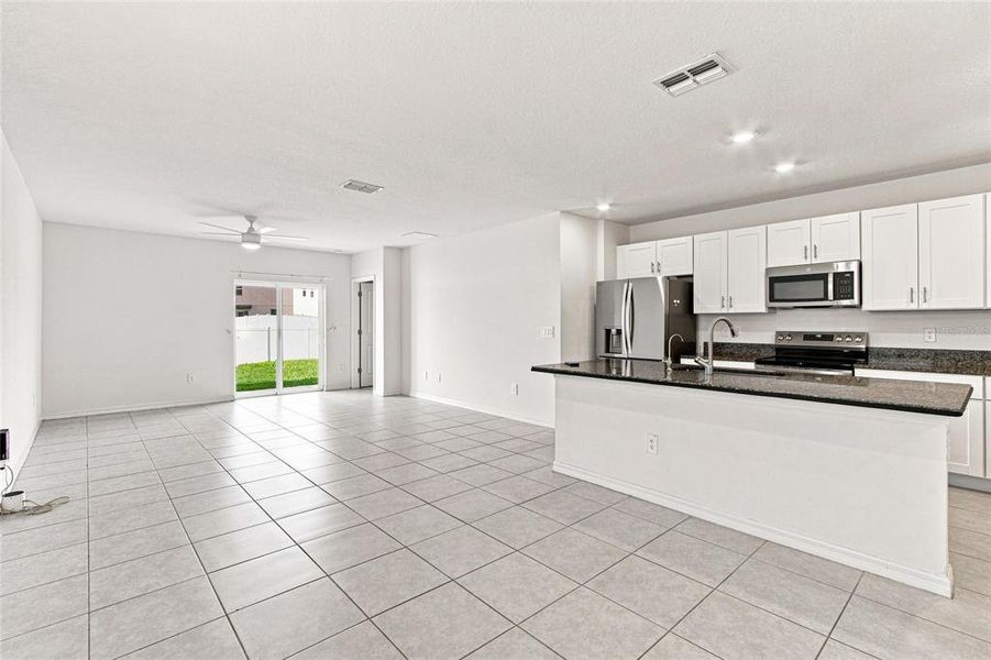 Furnished interior view inside a new home in The Isle of Avalon, Spring Hill (Image 7).